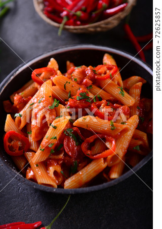 Penne pasta with chili sauce arrabiata 72625857