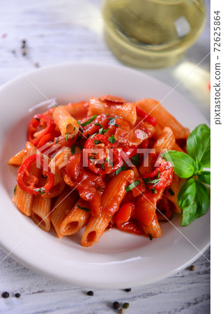 Penne pasta with chili sauce arrabiata 72625864