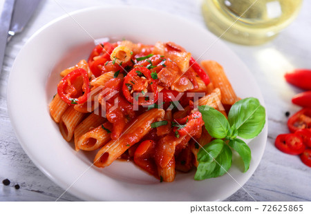 Penne pasta with chili sauce arrabiata Penne pasta with chili sauce arrabiata 72625865