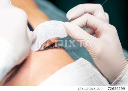 Close up put strip under eye. 72626299