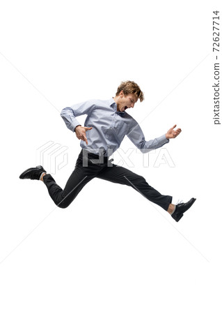 Happy young man dancing in casual clothes or suit, remaking legendary moves of celebrity from culture history 72627714