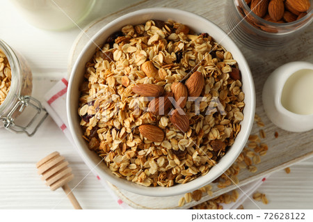 Concept of tasty breakfast with granola on white wooden background Concept of tasty breakfast with granola on white wooden background 72628122
