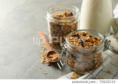 Concept of tasty breakfast with granola on gray background 72628134