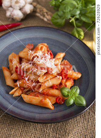 Penne pasta with chili sauce arrabiata 72628929