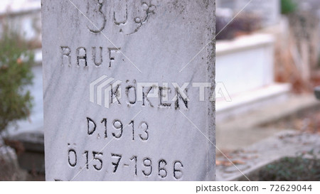 Weathered tombstone at islamic cemetery. 72629044