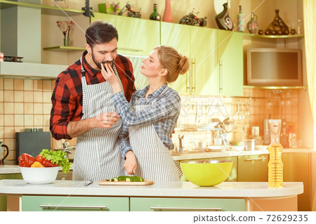 Kitchen and couple. Kitchen and couple. 72629235