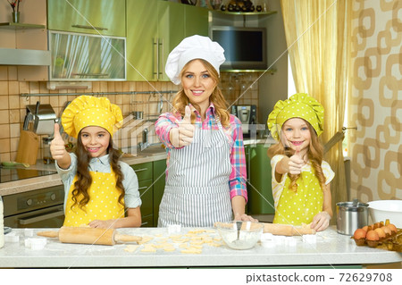 Female chef and children. Female chef and children. 72629708