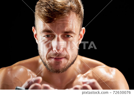 Tired sportsman during a workout 72630076