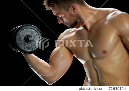 Young man is building muscles 72630124