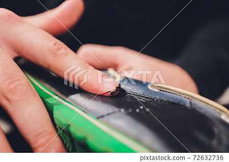 Brushes, wax, boots. applying cream with your finger. Shoe repair. 72632736