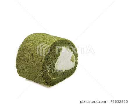 The close up of homemade matcha green tea cream roll soft cake dessert food on white background. The close up of homemade matcha green tea cream roll soft cake dessert food on white background. 72632830