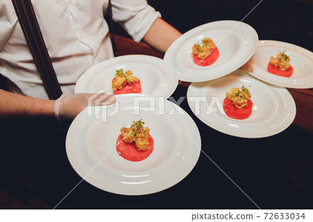 Delicious panna cotta dessert with raspberries sauce. 72633034