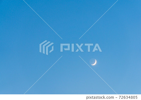 Crescent Moon and Earthshine in Blue Sky 72634805
