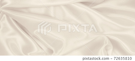 Smooth elegant golden silk or satin luxury cloth texture as wedding background. Luxurious background design. In Sepia toned. Retro style Smooth elegant golden silk or satin luxury cloth texture as wedding background. Luxurious background design. In Sepia toned. Retro style 72635810
