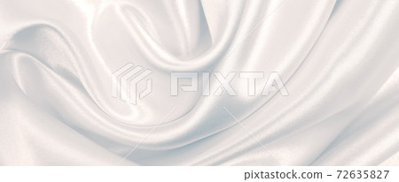 Smooth elegant grey silk or satin luxury cloth as wedding background. Luxurious background design Smooth elegant grey silk or satin luxury cloth as wedding background. Luxurious background design 72635827