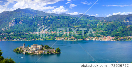 Beautiful lakes of Italy - lago d'Orta (Orta San Giulio ) and small pictorial island with monastery and village . Piedmont 72636752