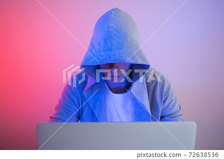 Gamer plays on a laptop. The programmer writes the code. Man on a colored background Gamer plays on a laptop. The programmer writes the code. Man on a colored background 72638536
