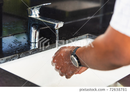 man hands rubbing with soap and water in sinks 72638781