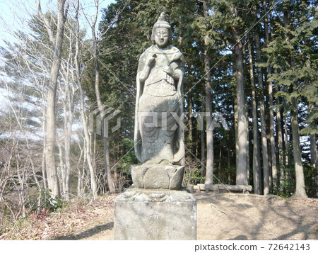 A statue of the Holy Kanzeon Bosatsu on the summit of Nakazawa on the South Takao Longitudinal Road 72642143