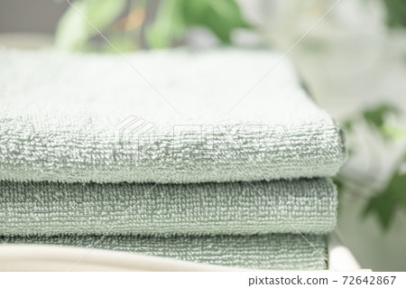 Folded and stacked towels Folded and stacked towels 72642867