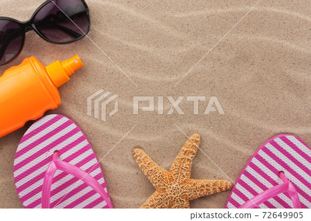 Beach accessories on sand beach. Beach accessories on sand beach. 72649905