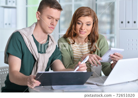 Portrait of young people working in office Portrait of young people working in office 72651020