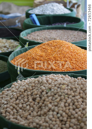 Uncooked assorted legumes. Healthy cereals in eco bags 72653466