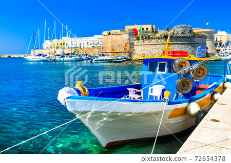 Old port of Gallipoli, view with castle amd boats, Puglia , Italy 72654378