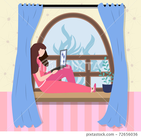 A woman works at a laptop while sitting on the windowsill at home. Freelance concept, quarantine due to covid-19 A woman works at a laptop while sitting on the windowsill at home. Freelance concept, quarantine due to covid-19 72656036