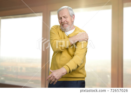 Old senior man with shoulder pain. Old senior man with shoulder pain. 72657026