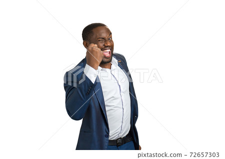 Succesful businessman with raised fist. Succesful businessman with raised fist. 72657303