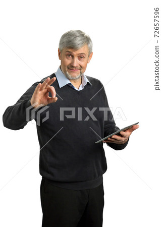 Handsome mature man showing Ok sign. 72657596