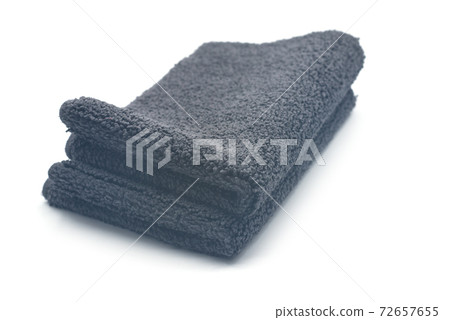 Closeup of black bathroom carpet pile on white background 72657655