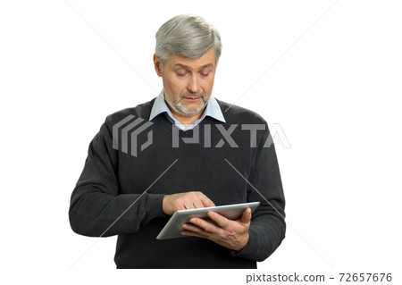 Confused mature man with pc tablet. 72657676
