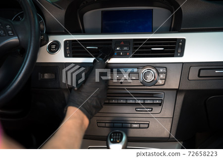 manual cleaning of the car interior with the help of brushing manual cleaning of the car interior with the help of brushing 72658223