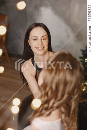 Mother with little daughter at home Mother with little daughter at home 72659822