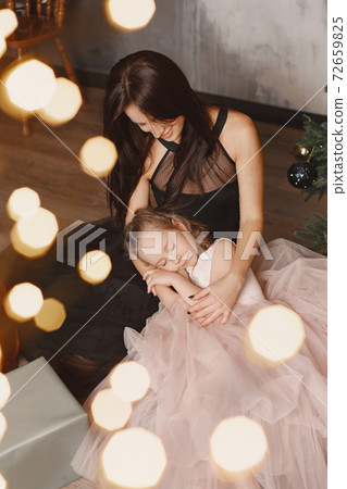 Mother with little daughter at home Mother with little daughter at home 72659825