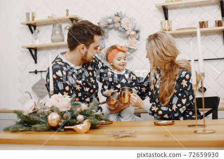 Family in identifical pajamas at home Family in identifical pajamas at home 72659930