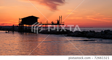 Stilt house over the sea 72661321