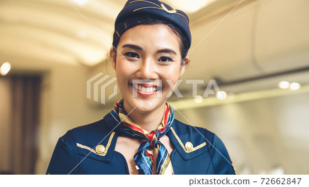 Cabin crew or air hostess working in airplane Cabin crew or air hostess working in airplane 72662847