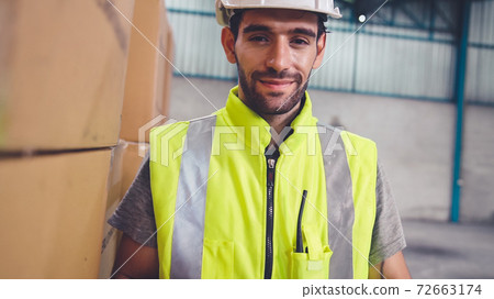 Professional industry worker close up portrait in the factory or warehouse Professional industry worker close up portrait in the factory or warehouse 72663174
