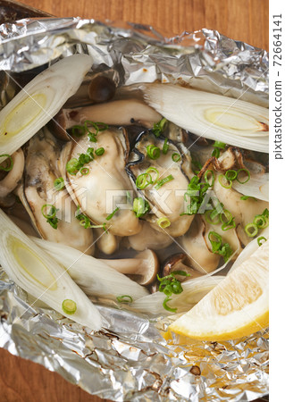 Grilled oysters in foil Grilled oysters in foil 72664141