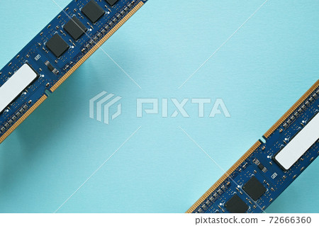 DDR3 expansion memory of two desktop PCs placed diagonally apart with the parts side shown on blue paper DDR3 expansion memory of two desktop PCs placed diagonally apart with the parts side shown on blue paper 72666360