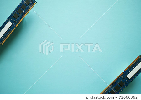 DDR3 expansion memory of two desktop PCs placed diagonally apart with the parts side shown on blue paper 72666362