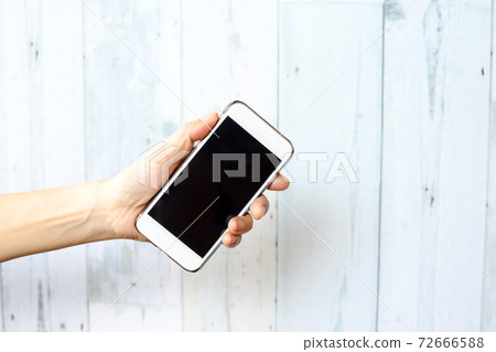 Women's hand with smartphone Women's hand with smartphone 72666588