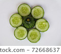 Fresh raw  sliced cucumber in white background 72668637