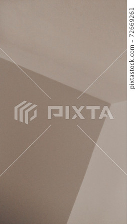 Beige background of a wall angle, or some geometrical figures. Beige background of a wall angle, or some geometrical figures. 72669261
