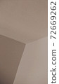 Beige background of a wall angle, or some geometrical figures. 72669262