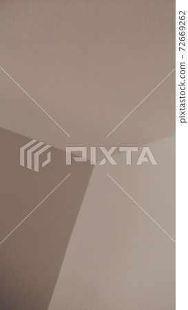 Beige background of a wall angle, or some geometrical figures. 72669262