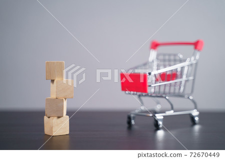 Close up shot of empty wooden blocks with shopping cart. Close up shot of empty wooden blocks with shopping cart. 72670449